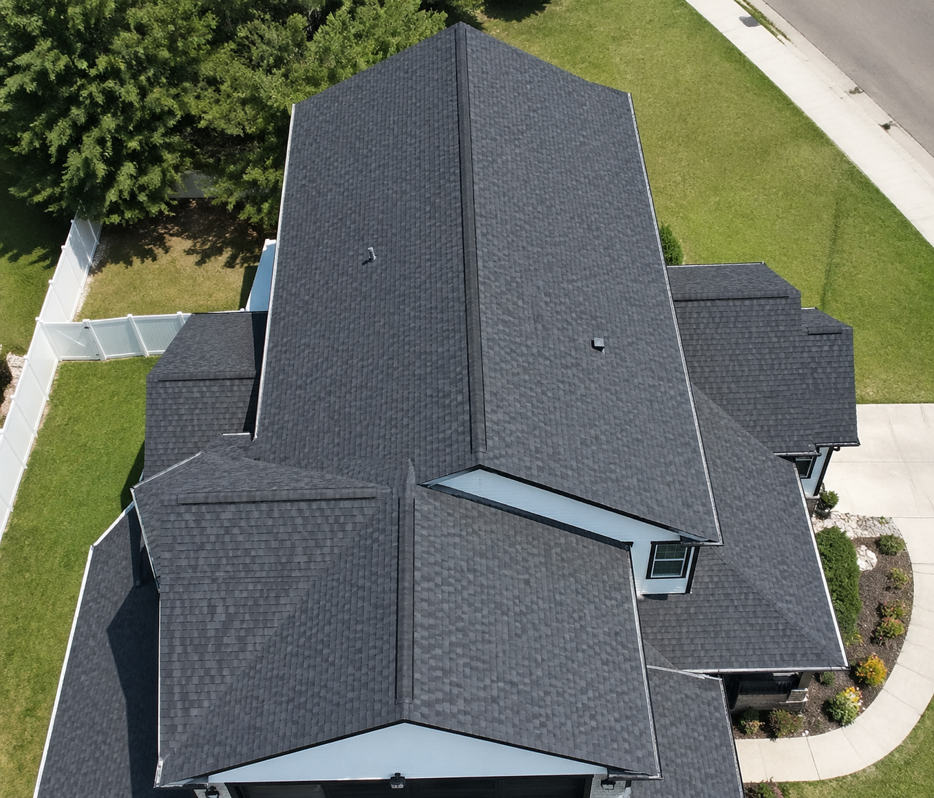After - brand new charcoal asphalt shingle roof, aerial view
