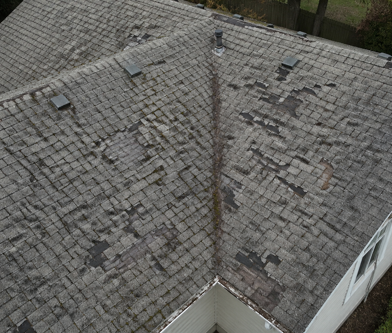 Before - worn damaged asphalt shingles needing replacement